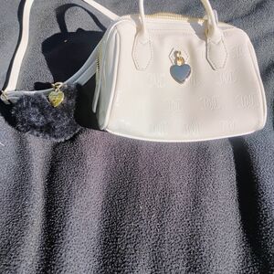 Juicy Couture White small Handbag with Adjustable Shoulder Strap And Charms